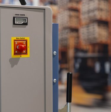 Wat doet de rode knop op de pers?